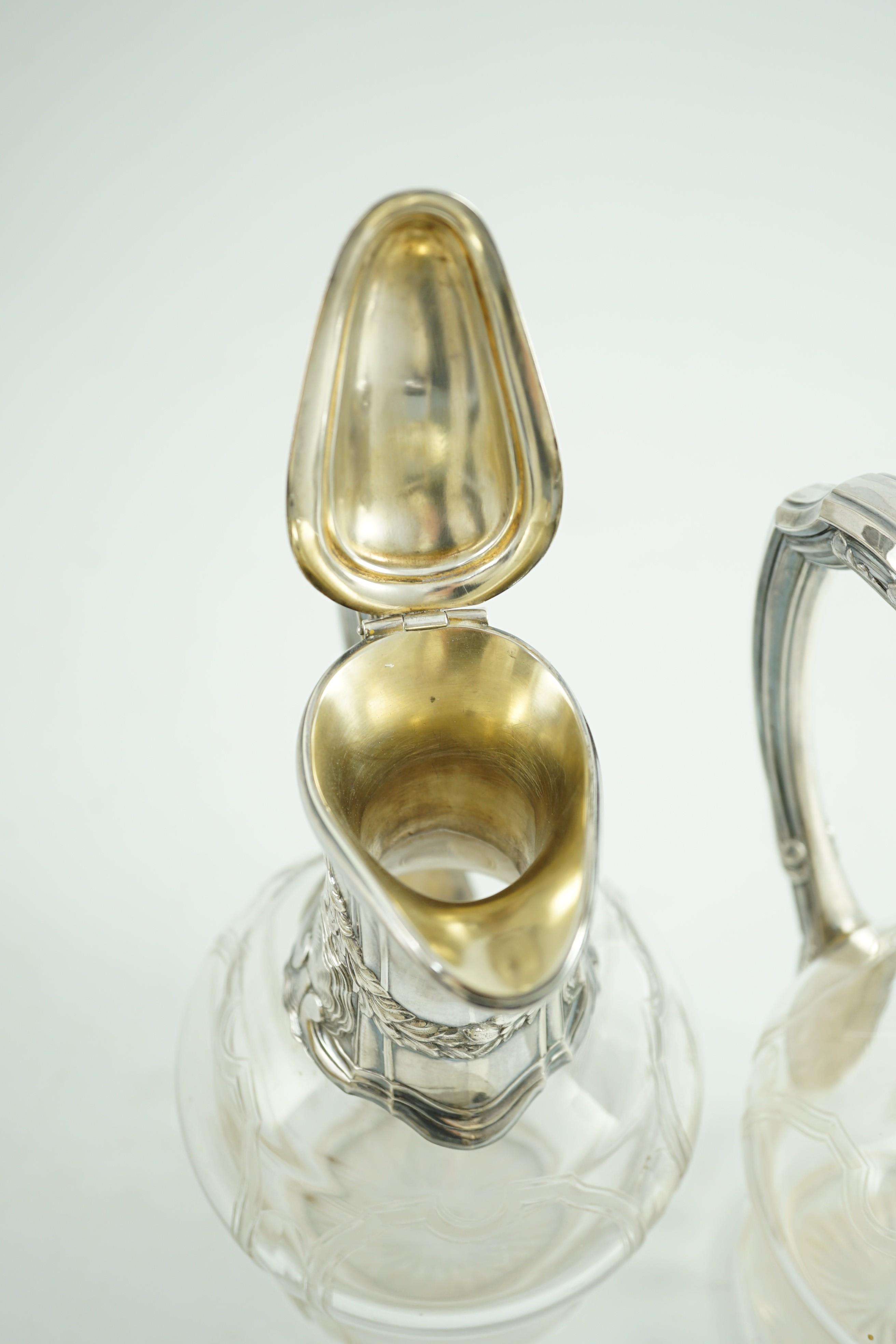A pair of early 20th century French 950 standard silver mounted glass claret jugs, by Risler & Carre